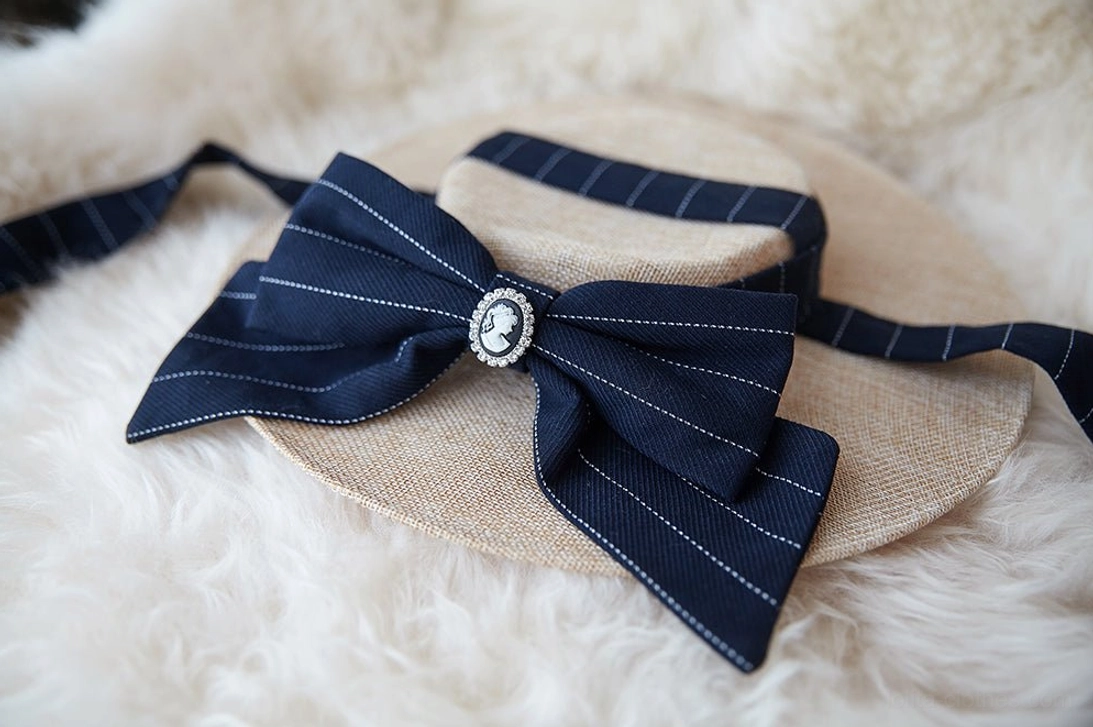 Handmade lolita flat hat with ribbon straps and decorative elements, overhead view showing the hat's structure and color coordination options