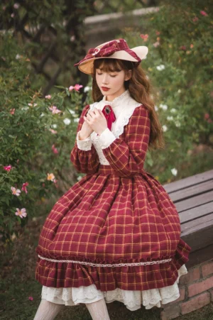 Rose Silhouette red tartan vintage classic Lolita OP dress front view with white lace ruffled collar and red bow neck ornament in outdoor garden setting