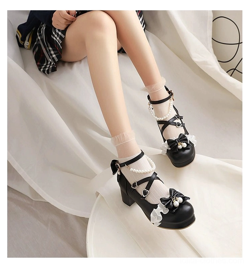 Round-toe sweet lolita heels full shoe silhouette showing complete design from heel to toe, chunky block heel construction, rounded toe cap with ruffle trim, cross buckle straps, and bow decoration with pearl accents