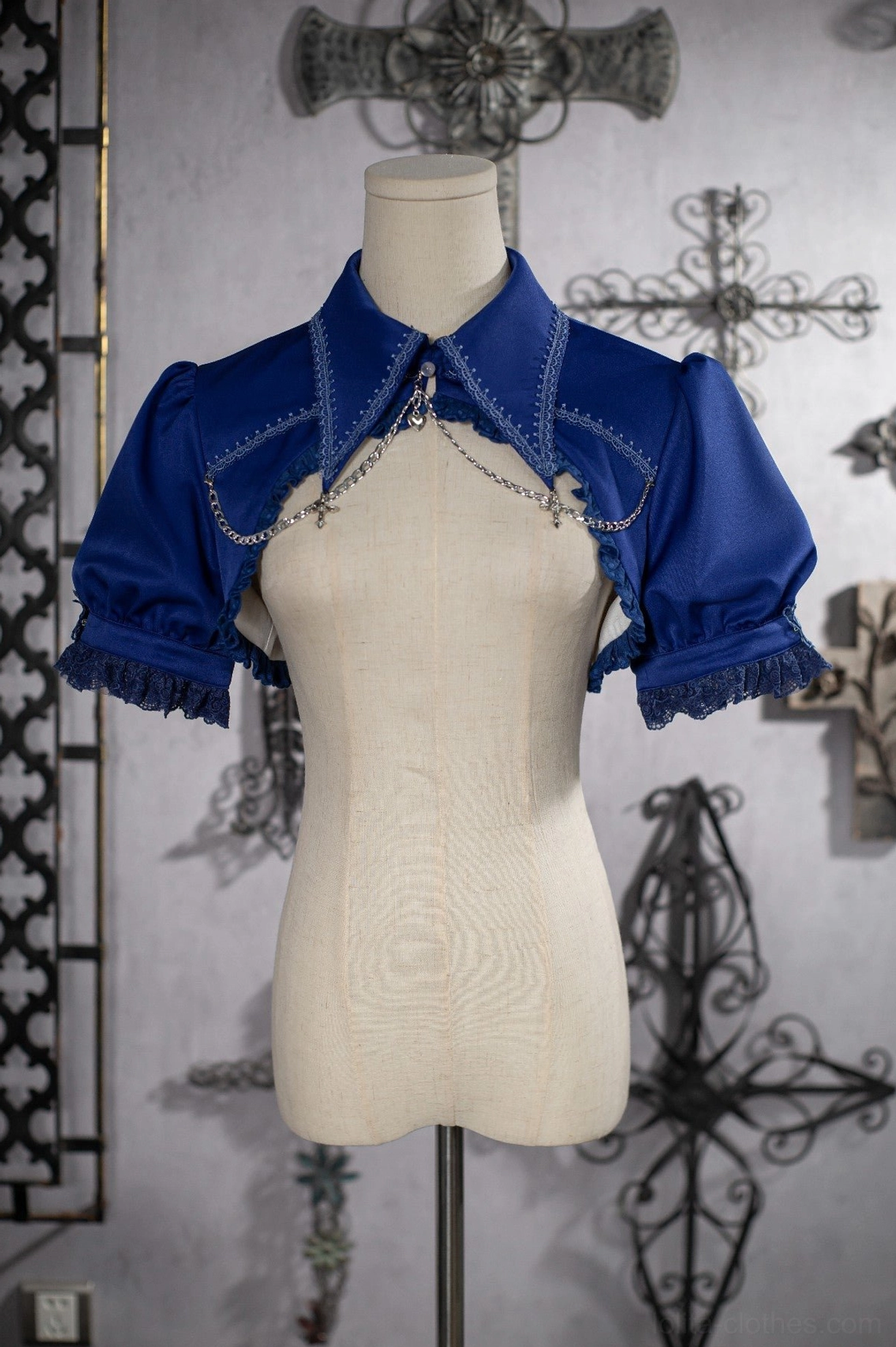Royal blue gothic cropped bolero with ruffled lace cuffs and pointed collar front mannequin view