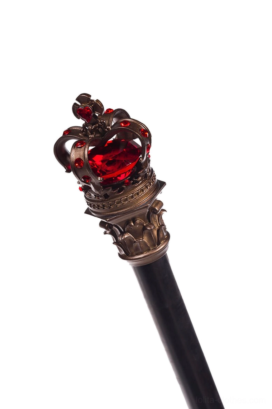 Close-up detail view of royal lolita scepter head with red gem inlaid bronze crown top attached to matte black polished pole