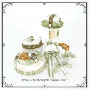 Assorted sage green and ivory Lolita hair accessories flat lay featuring mini top hats decorative bows and pearl-trimmed ornaments on white background