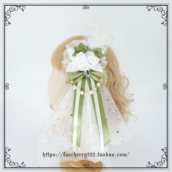 Sage green and cream Lolita hair accessory set showing multiple coordinated bow designs with pearl accents and ribbon embellishments