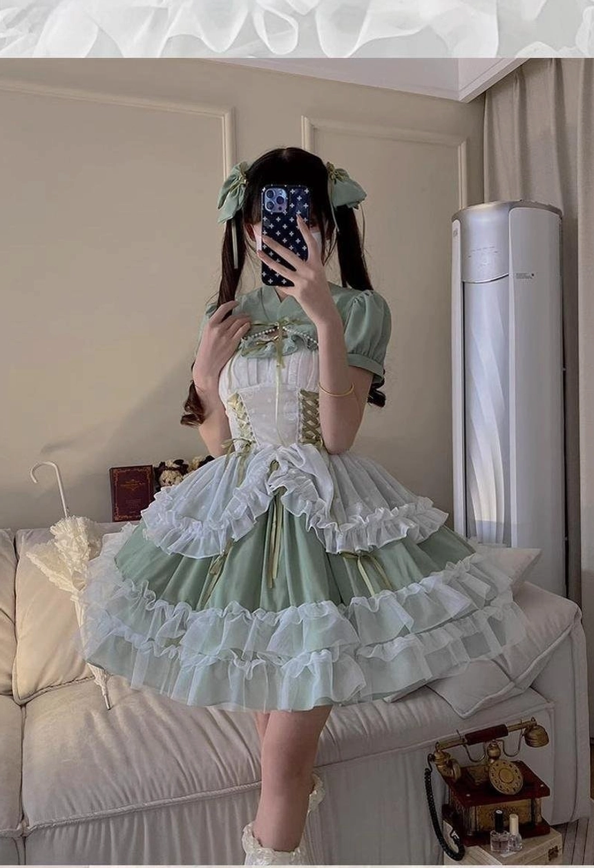 Sage green wedding lolita JSK jumper skirt from back view highlighting fully elastic back panel, corset construction, and comfortable plus-size fit features