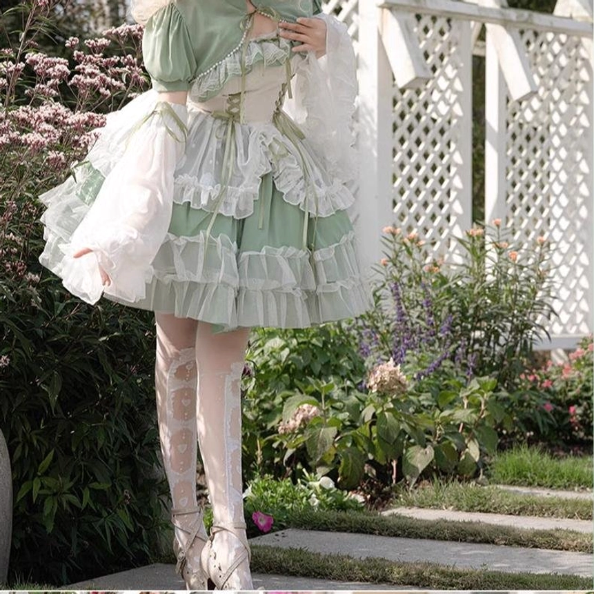 Sage green lolita wedding JSK showing long version with extended floor-length skirt, dramatic silhouette, and full bridal presence for ceremonial wear
