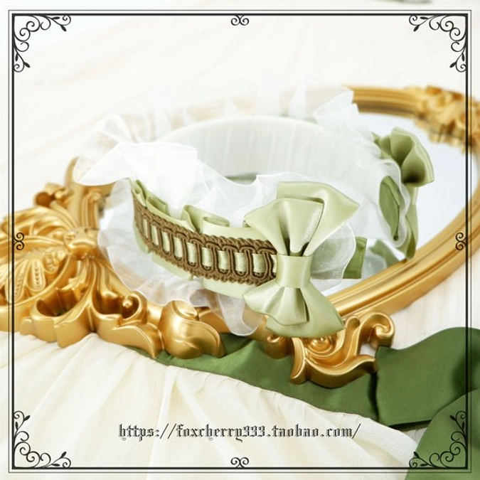 Sage green Lolita mini top hat headdress back view displaying full construction with layered details ruffled elements and decorative brooch