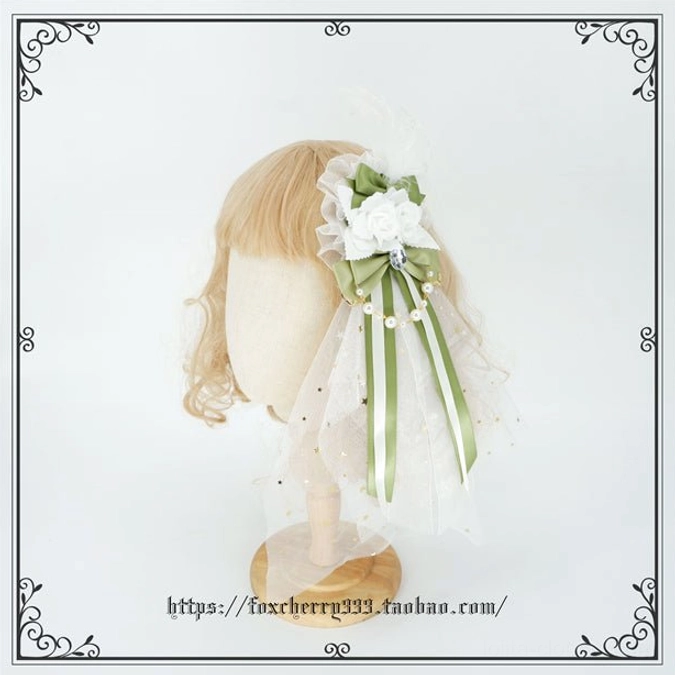Sage green Lolita mini top hat headdress full product shot demonstrating structural design pearl details and lace trim craftsmanship