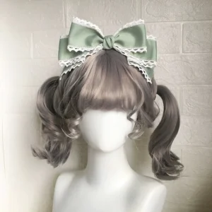 Sage green layered lolita kc bow headwear with white lace trim and twin curly wigs mannequin display