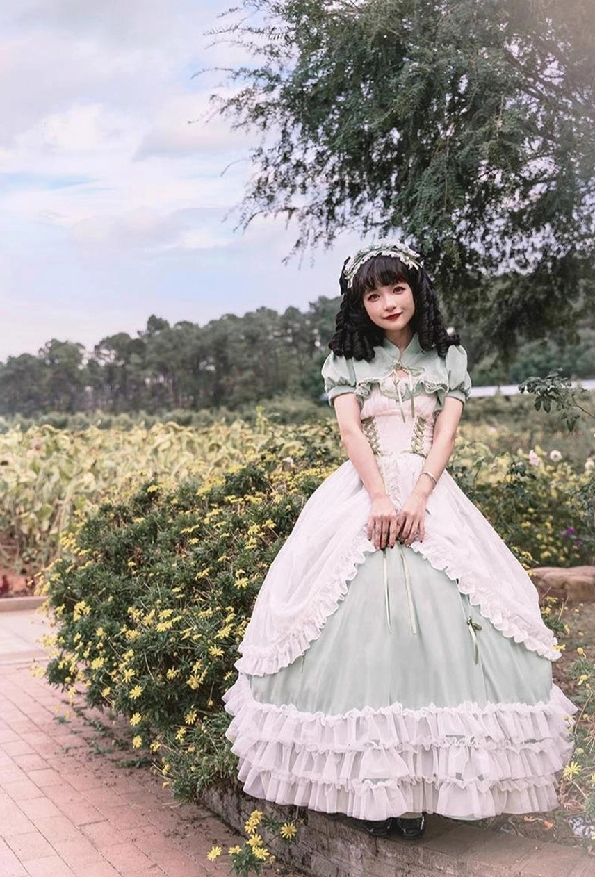 Sage green plus size wedding lolita JSK detail shot showing adjustable elastic back panel, corset boning, and fitted waistline construction for plus-size figure support
