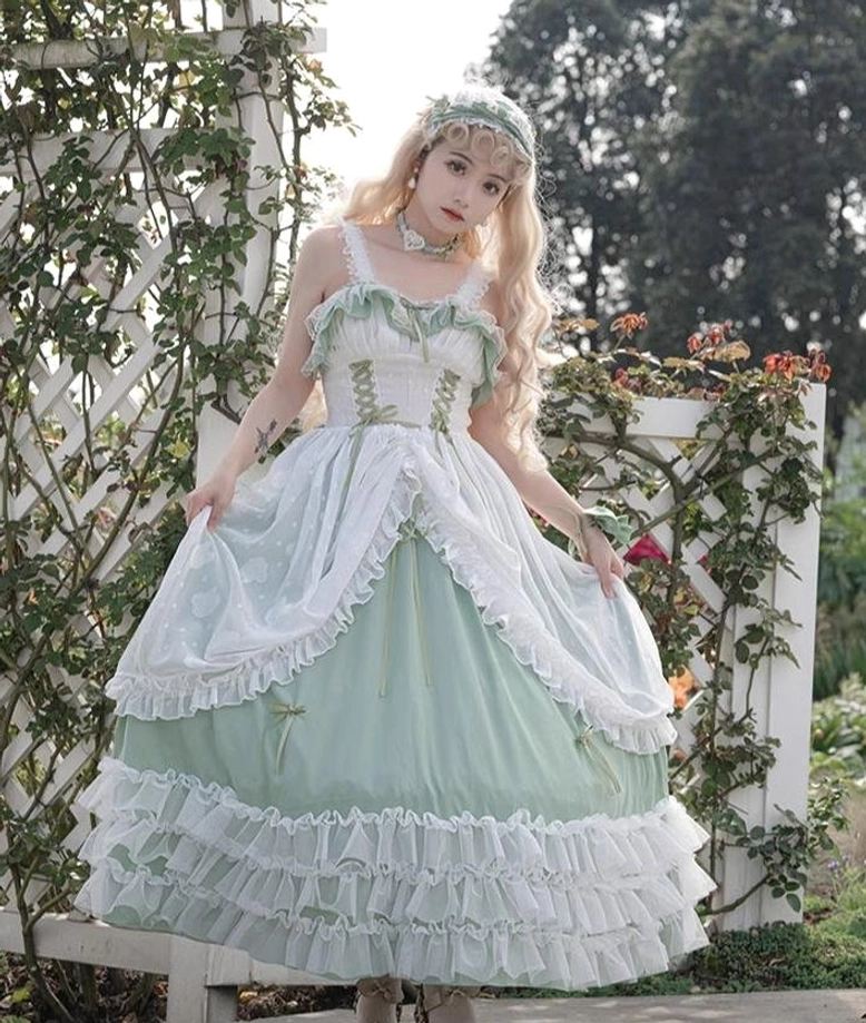 Sage green wedding lolita JSK jumper skirt showing cascading layered tiers of ruffled white lace, romantic volume, and signature Lolita aesthetic from multiple angles