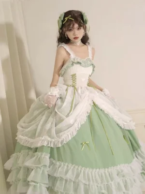 Front full-body view of sage green plus size wedding lolita JSK jumper skirt with ruffled trims, corset bodice, layered tiered skirt with small bow accents, and adjustable elastic straps