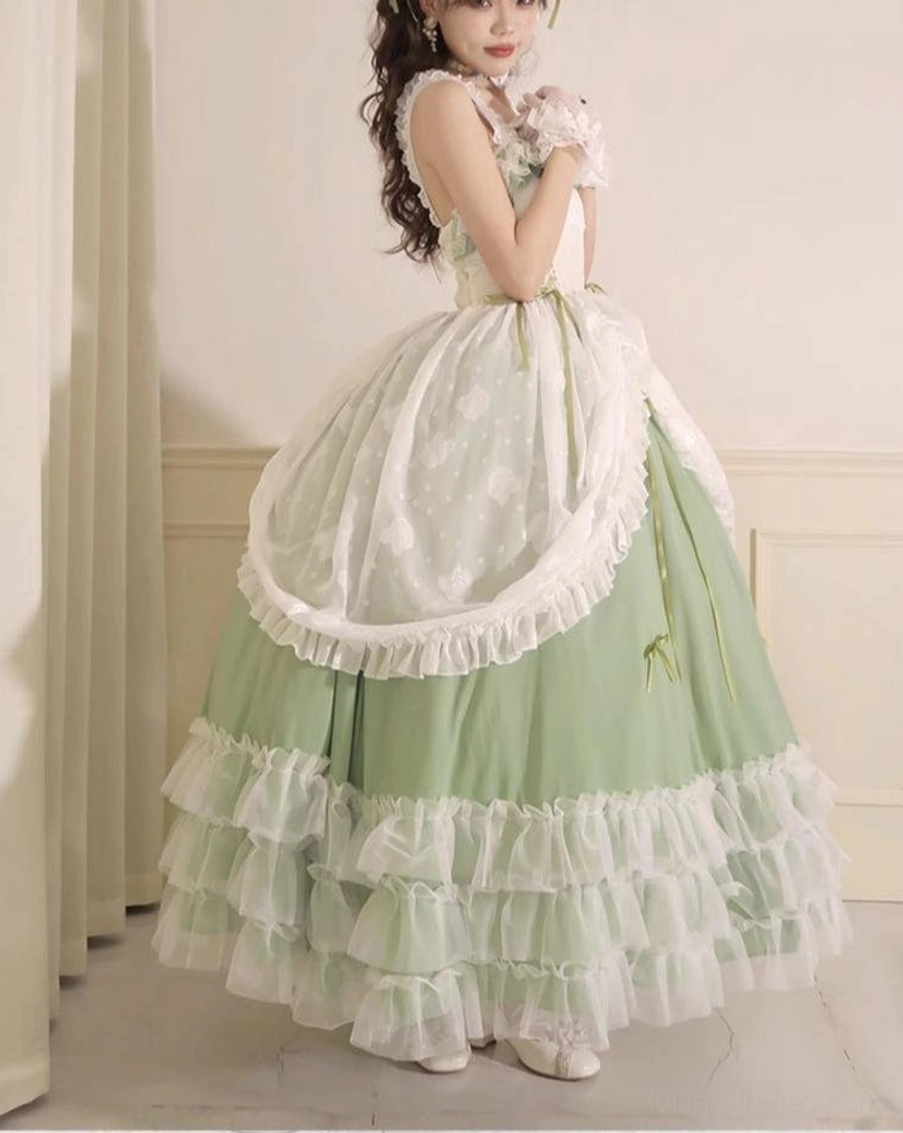 Sage green plus size bridal lolita JSK photographed in indoor studio setting showcasing color depth, print details, and elegant drape of fabric against neutral background