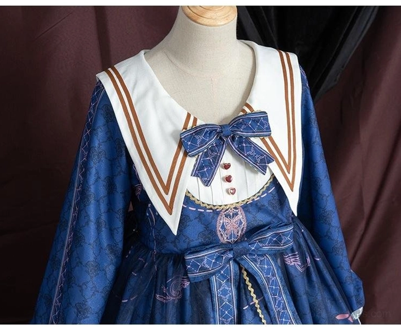 Sailor collar lolita one-piece dress with coordinating accessories, vintage brooch, cameo pendant, structured handbag, formal lolita presentation