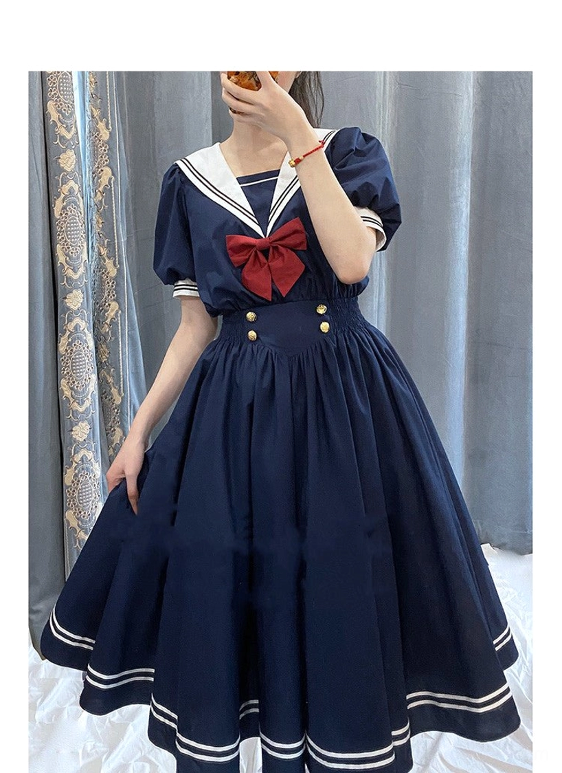 Sailor lolita OP dress detail shot collar cuff trim construction featuring white contrast sailor collar golden decorative buttons authentic lolita design
