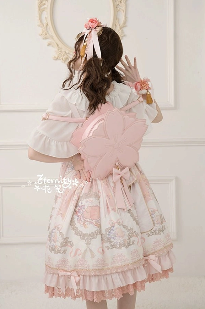 Sakura petal lolita handbag close-up detail shot showing 3D flower petals leather bow and tassel decoration craftsmanship