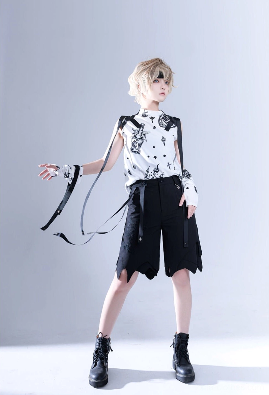 Full frontal standing view of Shadow Story lolita sleeveless shirt with black and white print, detachable decorative shoulder straps, and long hanging ribbon accessories for Ouji aesthetic