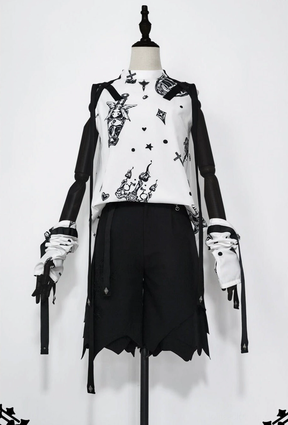 Full frontal view of black and white printed Ouji lolita sleeveless summer shirt on dress form mannequin, featuring attached black sleeve accents, detachable ribbon accessories, and structured silhouette