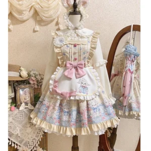 Goat Baa Bedtime Story sheep print kawaii lolita JSK dress with detachable apron front display on dress form showing cream ruffled trims and pink front bow