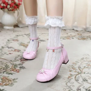 Pink Sweet Lolita Mary Jane round toe shoes with ankle strap bow detail and pearl vamp ornament, worn with frilly lace socks on vintage carpet