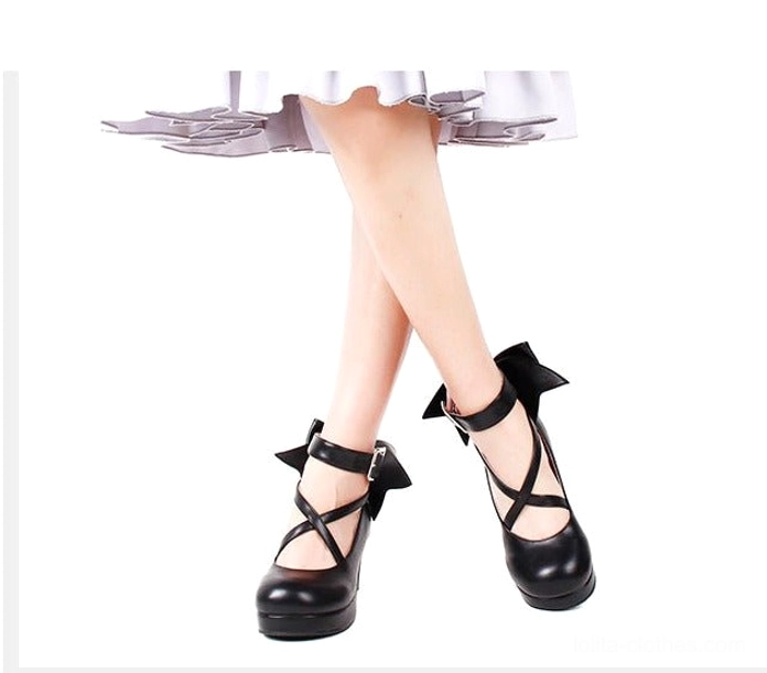 Shining white metallic Lolita platform heels with glossy reflective finish, crossover ankle buckle straps, large oversized decorative back bow, round platform toe, and block heel - color option