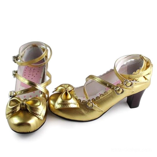 Shiny gold metallic lolita heels with crisscross ankle straps, decorative front bow, block mid-heel, branded insole, front three-quarter view pair display