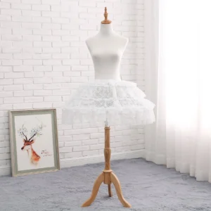 Short fluffy white lolita petticoat with ruffled floral lace hem and elastic waistband showing compact a-line silhouette