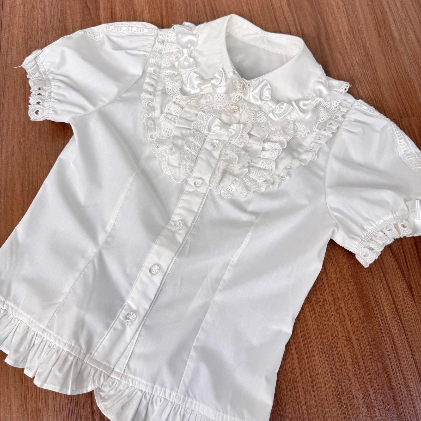 Short sleeve blouse for old school lolita coordinate in white with white ribbon bows, displaying clean sweet lolita aesthetic and refined tailoring for versatile coordinate styling