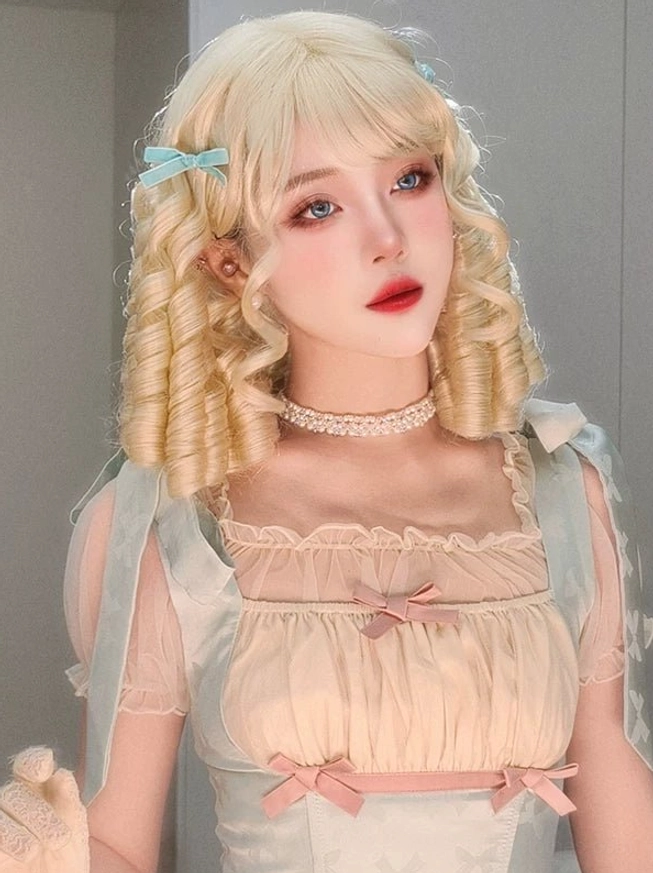 Shoulder-length blonde lolita curly wig soft spiral curls creamy tone with pink bows pastel vintage dress