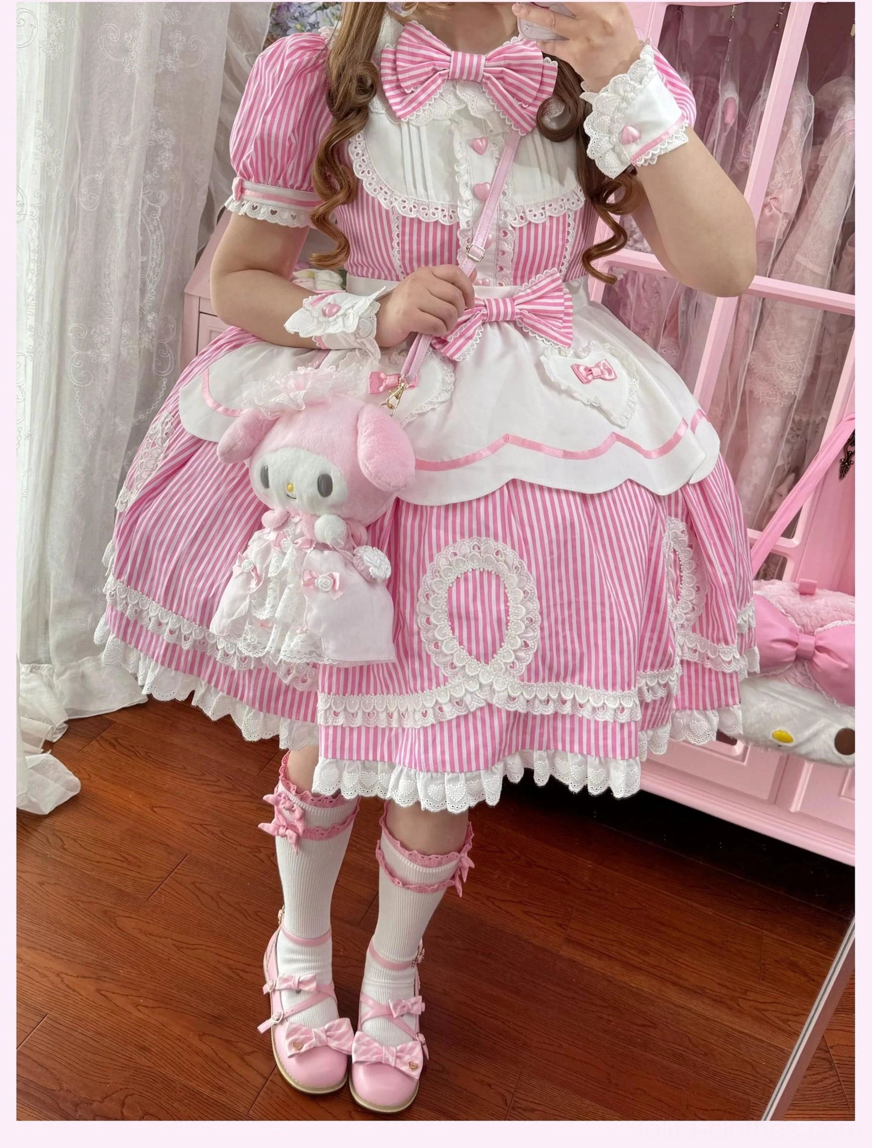 Side-by-side comparison of pink and blue striped lolita OP dresses showing color variation options