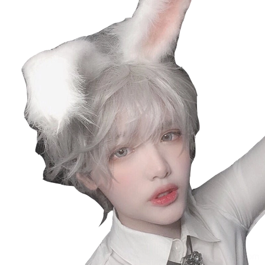 Overhead three-quarter view of tousled silver gray short curly wig with white fluffy rabbit ear visible