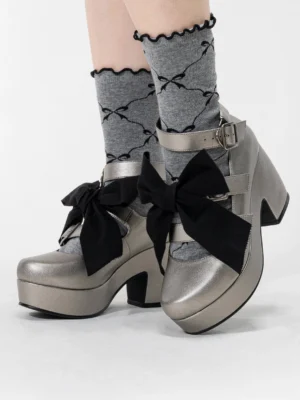 Silver-grey Gothic Lolita platform heel shoes with detachable bow and patterned ruffled crew socks, chunky platform heel, adjustable silver buckle ankle straps, front oblique view on model legs