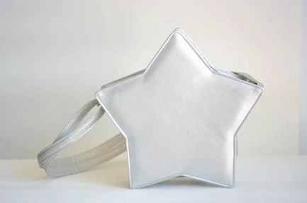 Silver metallic five-pointed star Lolita messenger bag side oblique angle, silvery white color with light grey adjustable shoulder strap and smooth matte finish