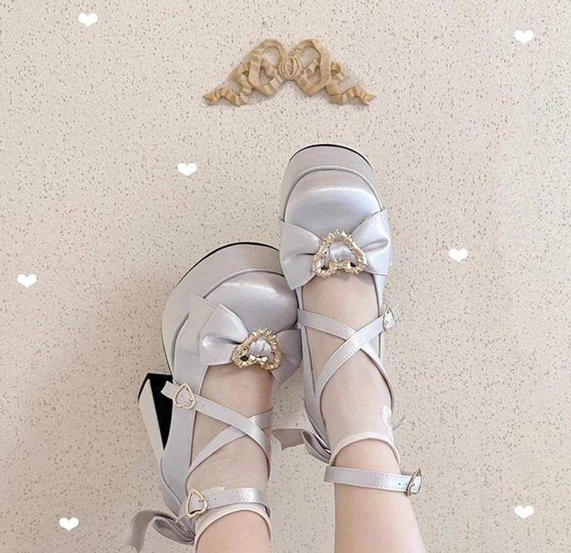 Silver Sweet Lolita heart bow Mary Jane platform heels overhead flat lay on textured heart decorated wall with angel ornament