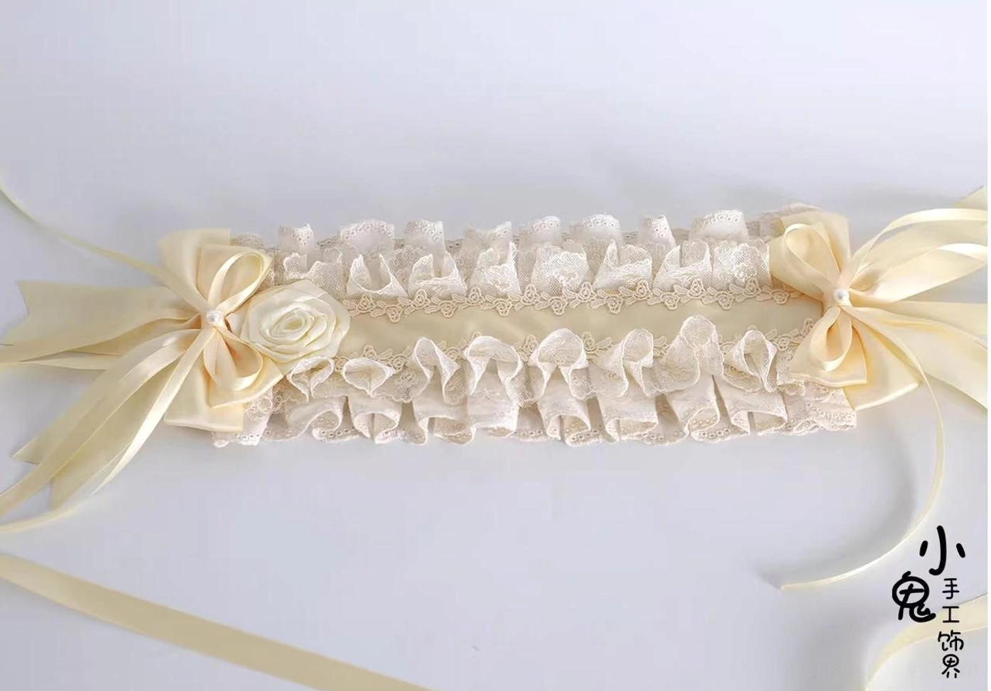 single-ruffled-cream-lace-lolita-hairband-double-beige-satin-bows-central-fabric-rose-decoration-flat-lay