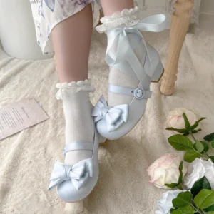 Sky blue Sweet Lolita satin Mary Jane heel shoes featuring large front satin bow and crisscross ankle straps, close-up eye-level view with white lace socks