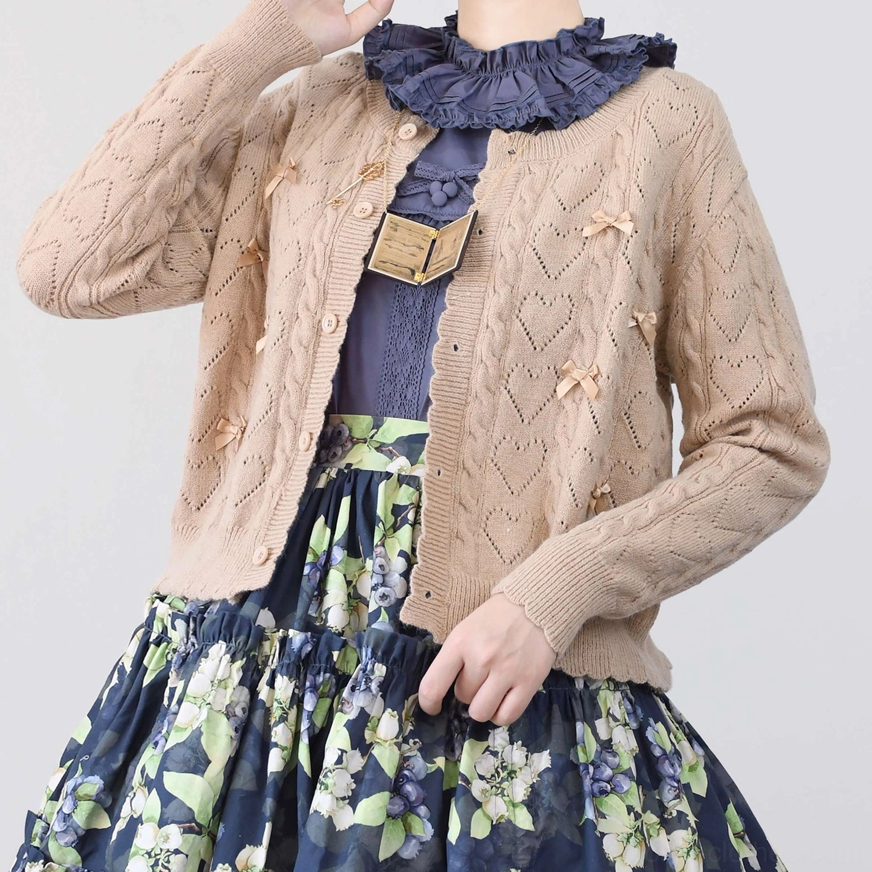 Size XL dark brown hollow out Lolita cardigan on model, showing fit and silhouette for larger sizing