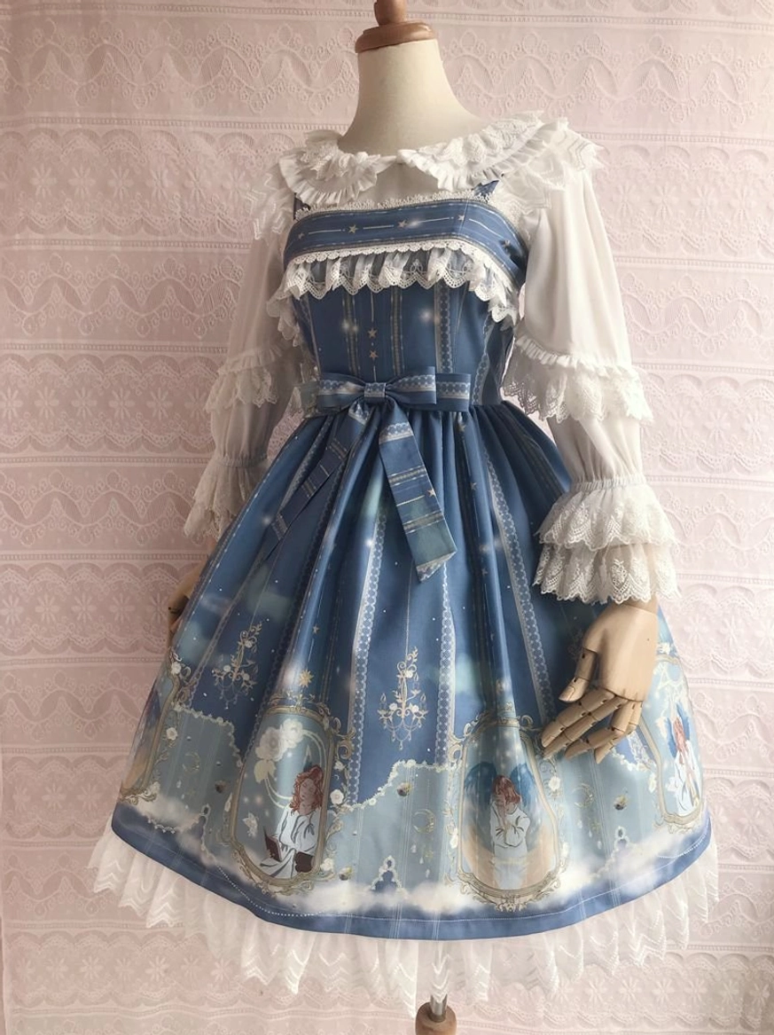 Sky blue angel-printed Lolita jumper skirt with waist sash bow, lace trim, and celestial angel motifs - front display view