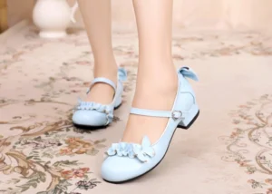 Sky blue handmade sweet Lolita Mary Jane shoes with ruffle butterfly details and ankle heart buckle on model wearing lace socks