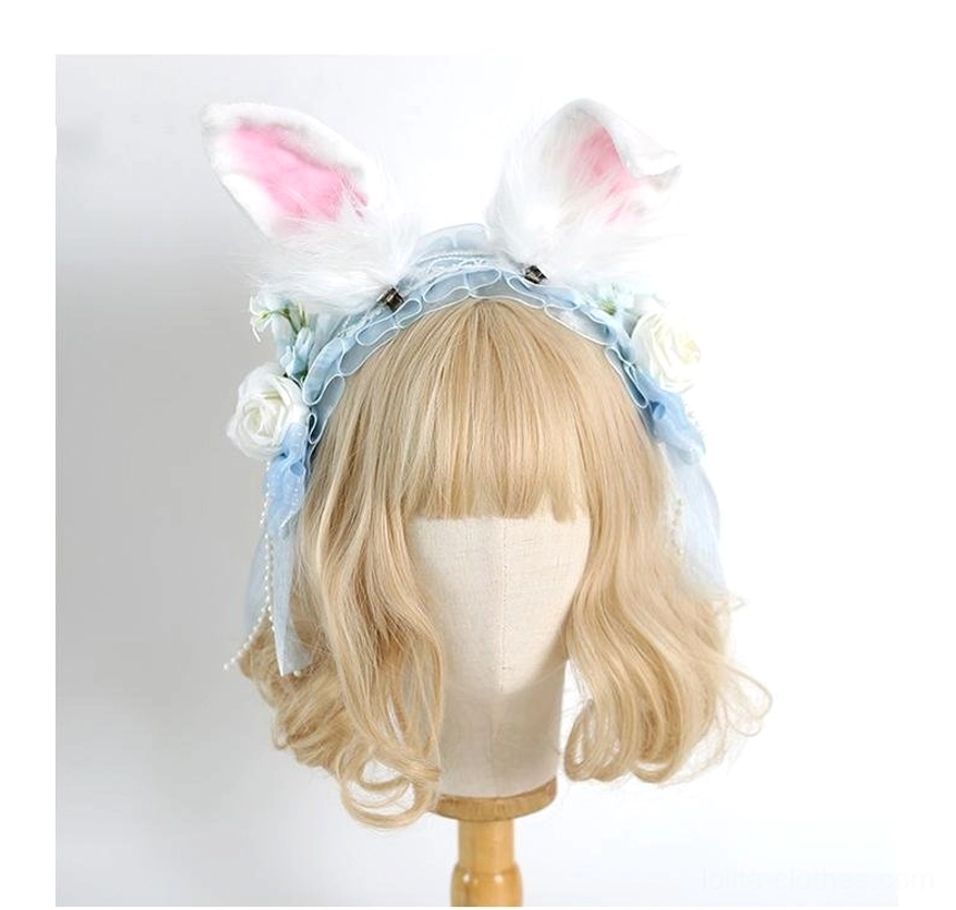 Sky blue lolita headband with fluffy rabbit ears and white artificial roses on mannequin model front view