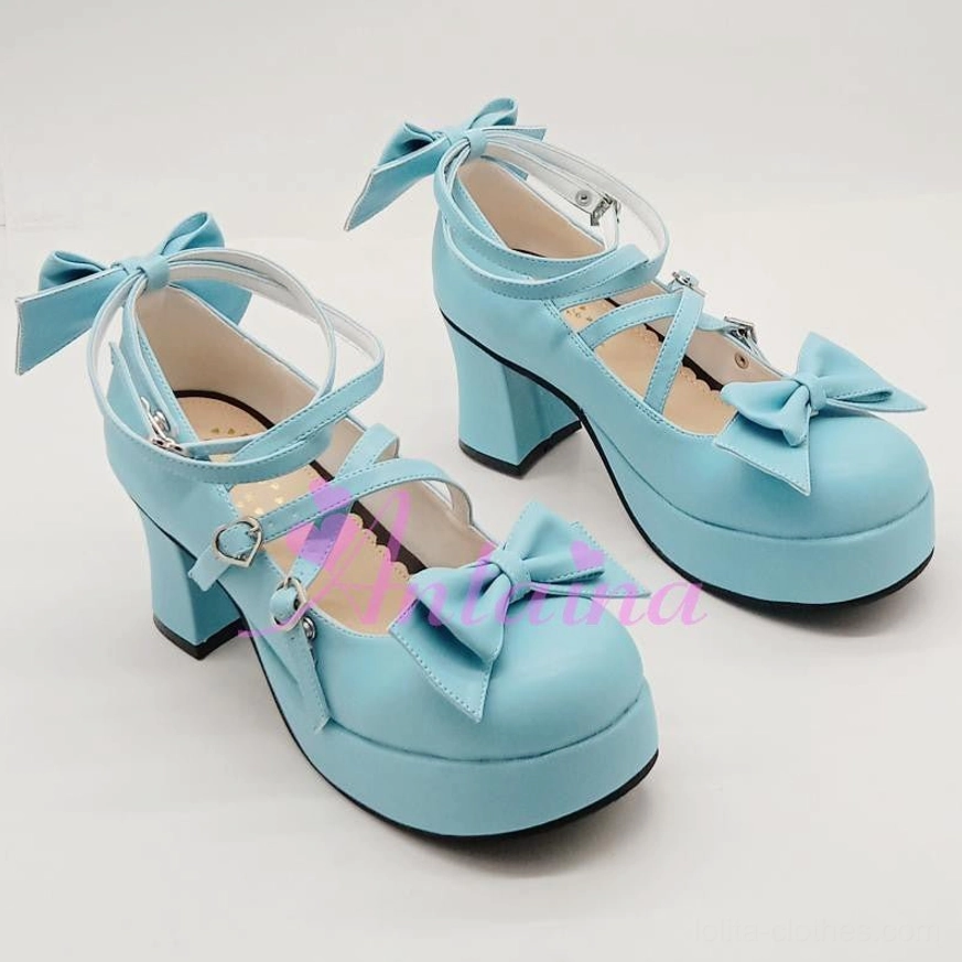 Front top-down view of sky blue glossy Lolita Mary Jane platform shoe featuring dual crisscross ankle straps and bow toe cap decorations