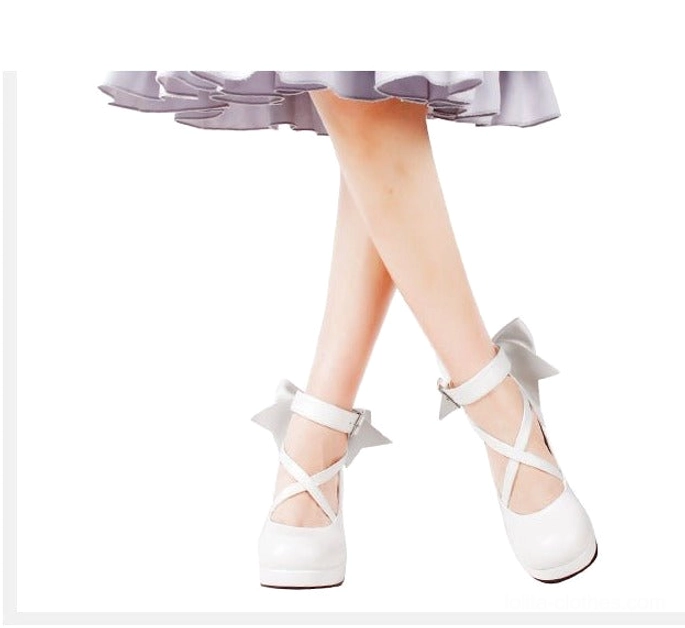 Sky blue Lolita platform high heel shoes in pale blue tone, with crossover ankle buckle straps, decorative back bow, round platform toe, and chunky block heel - versatile color option