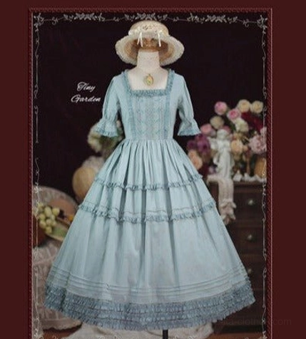 Sky blue dusty square collar pin tucks vintage lolita OP dress full body front view on display mannequin showcasing ruffled tiered skirt and elegant silhouette