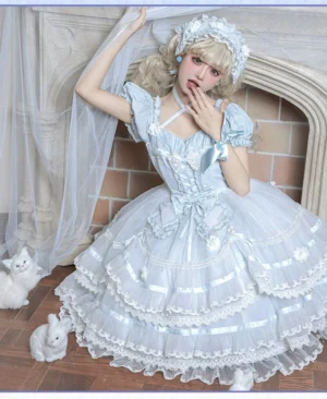 Sky blue sweet lolita one-piece dress with voluminous tiered ruffled skirt, puff short sleeves, halter cross strap neckline and floral chiffon details - full body modeling shot