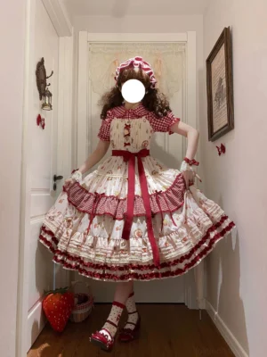Skyfaring strawberry classic lolita JSK dress with matching hair bonnet worn by model in home hallway, showcasing red gingham tiered ruffled skirt and red waist sash from back three-quarter angle