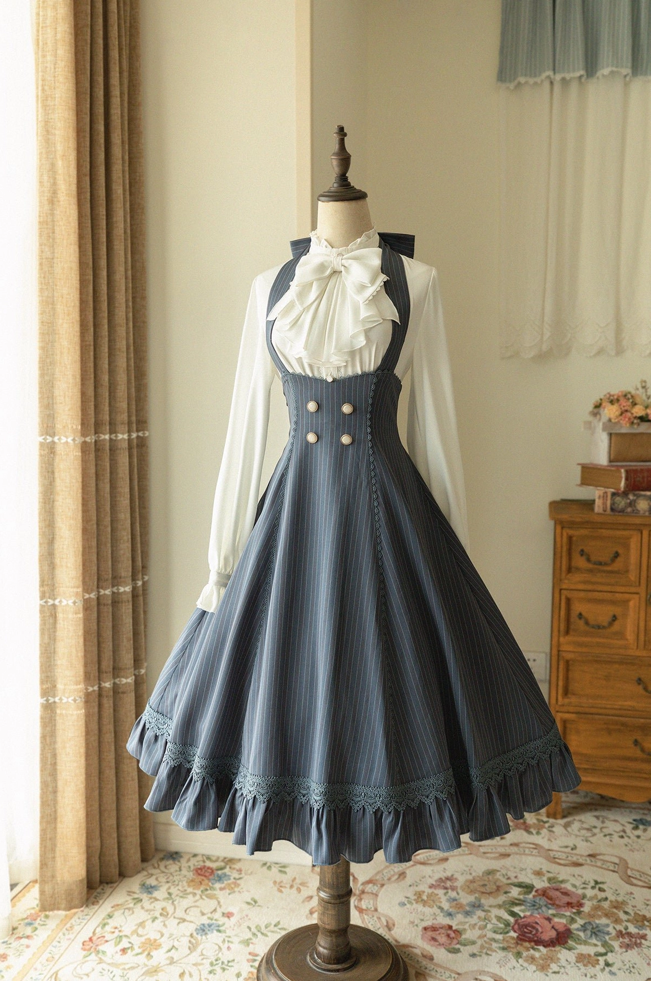 Slate blue grey pinstripe vintage halter JSK dress with ruffled lace hem, front view dress form display double-button decoration, classic lolita fashion