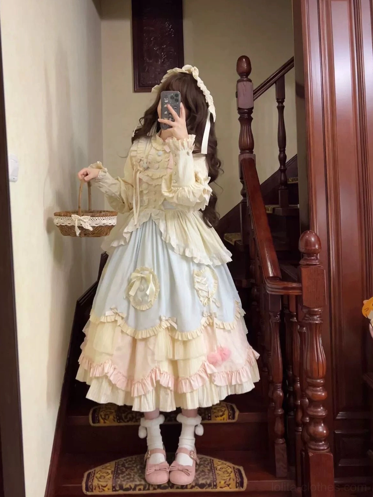 Mirror selfie view of sweet lolita OP dress on wooden staircase holding wicker basket matching frilled socks and flats delicate lace appliques on dress bodice