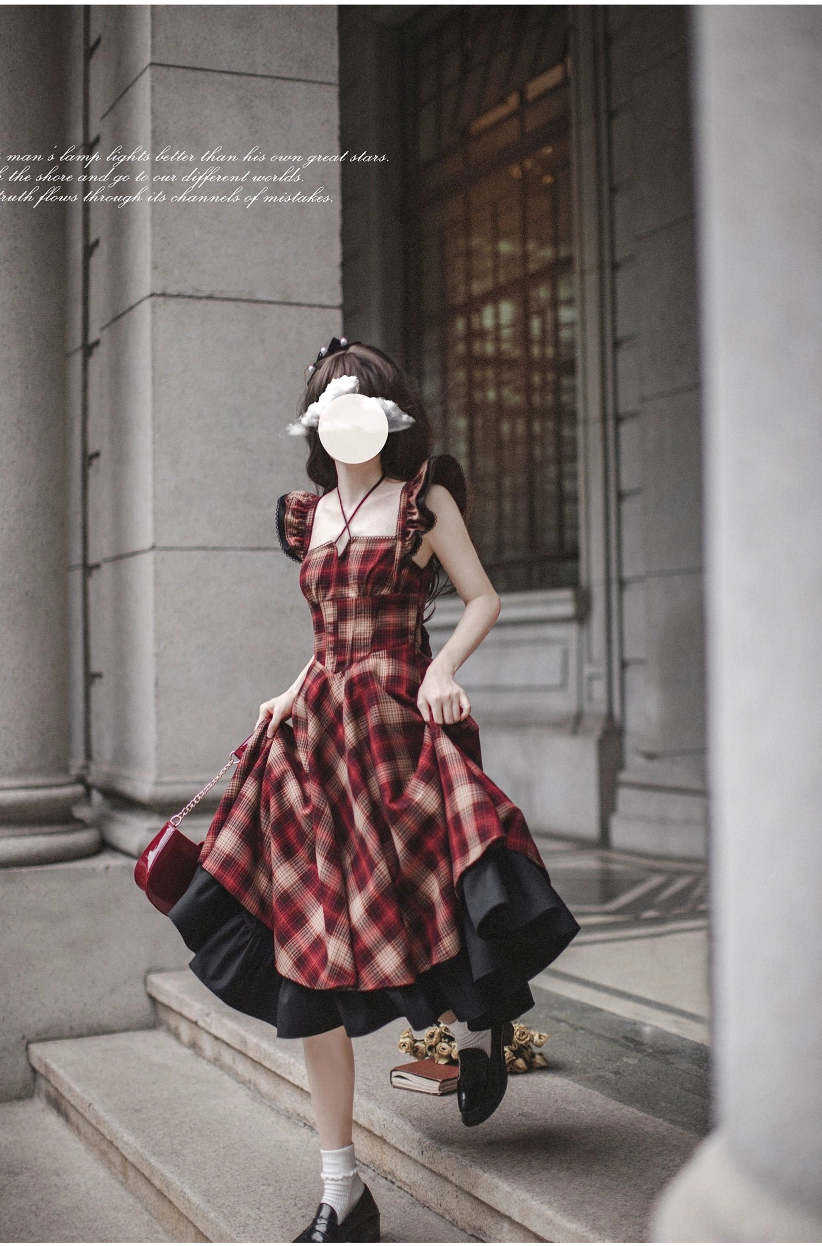 Sleeveless red plaid lolita JSK jumper skirt with double-layer black ruffled hem and scalloped shoulder straps - worn without inner blouse or coat, front stair walking view on European stone stairs
