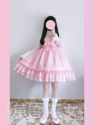 Soft pink sweet lolita jumper skirt JSK dress front view with white blouse and knee-high socks