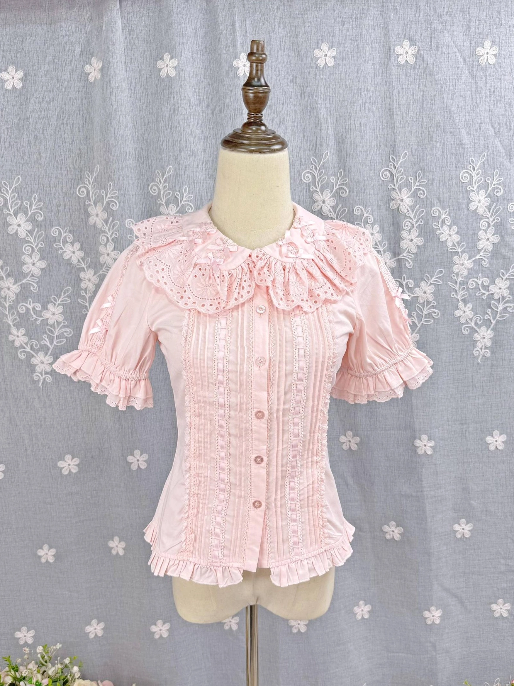 Soft pink Sweet Lolita Peter Pan collar blouse front flat display showing ruffled details pleated bodice and button closure