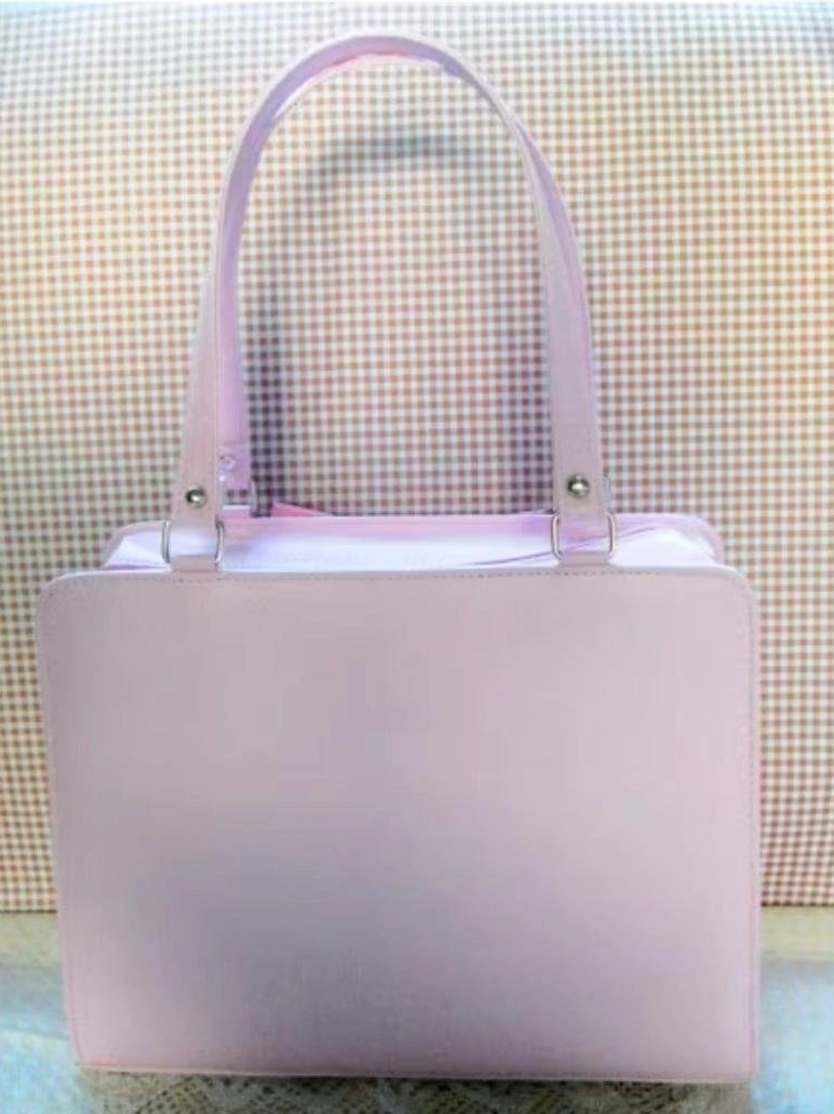 Solid pastel pink Lolita PU structured top handle handbag with smooth finish and silver hardware